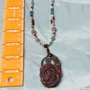 Ornate Purple and Green Necklace with Intricate Carved Pendant